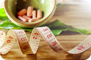 Set of various Nutralux vitamin bottles on a white background