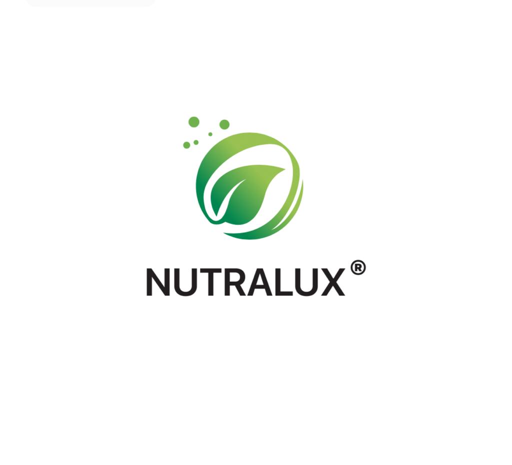 Woman holding a Nutralux vitamin bottle with a green label